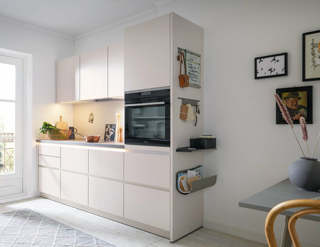 Schuller Light Matt Compact Handleless Kitchen 1 | Sia Kitchens, Hertfordshire
